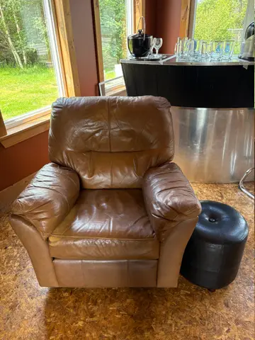 146: Brown Leather Recliner and Poof - 38 x 40 - online auction on EastBid